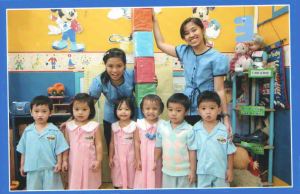 with her teachers and classmates