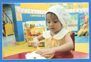 The little chef :) slicing her pear