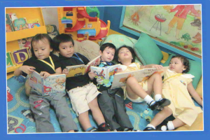 Ria with her classmates, reading books